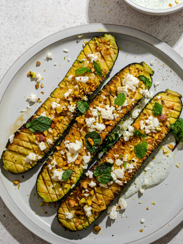 A serving of Thomas Keller zucchini with sauce, garnishes and toppings.