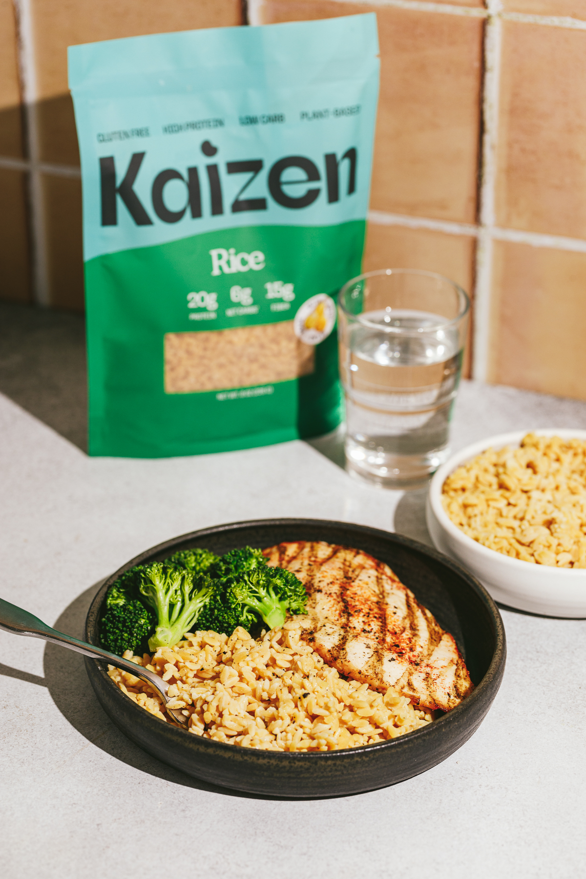 A bowl of kaizen rice with sides for low carb rice alternatives.