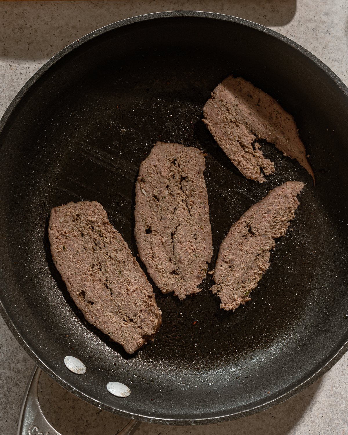 Cooked gyro meat in a skillet for homemade gyro bowl recipe