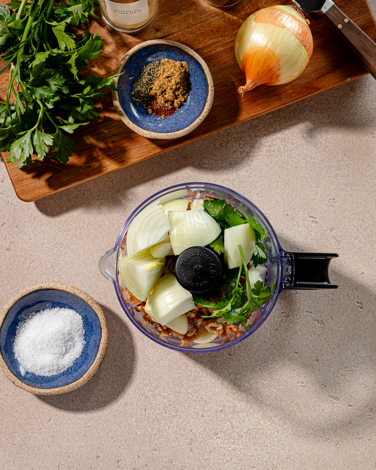 Ingredients for gyro bowl recipe in a mini food processor.