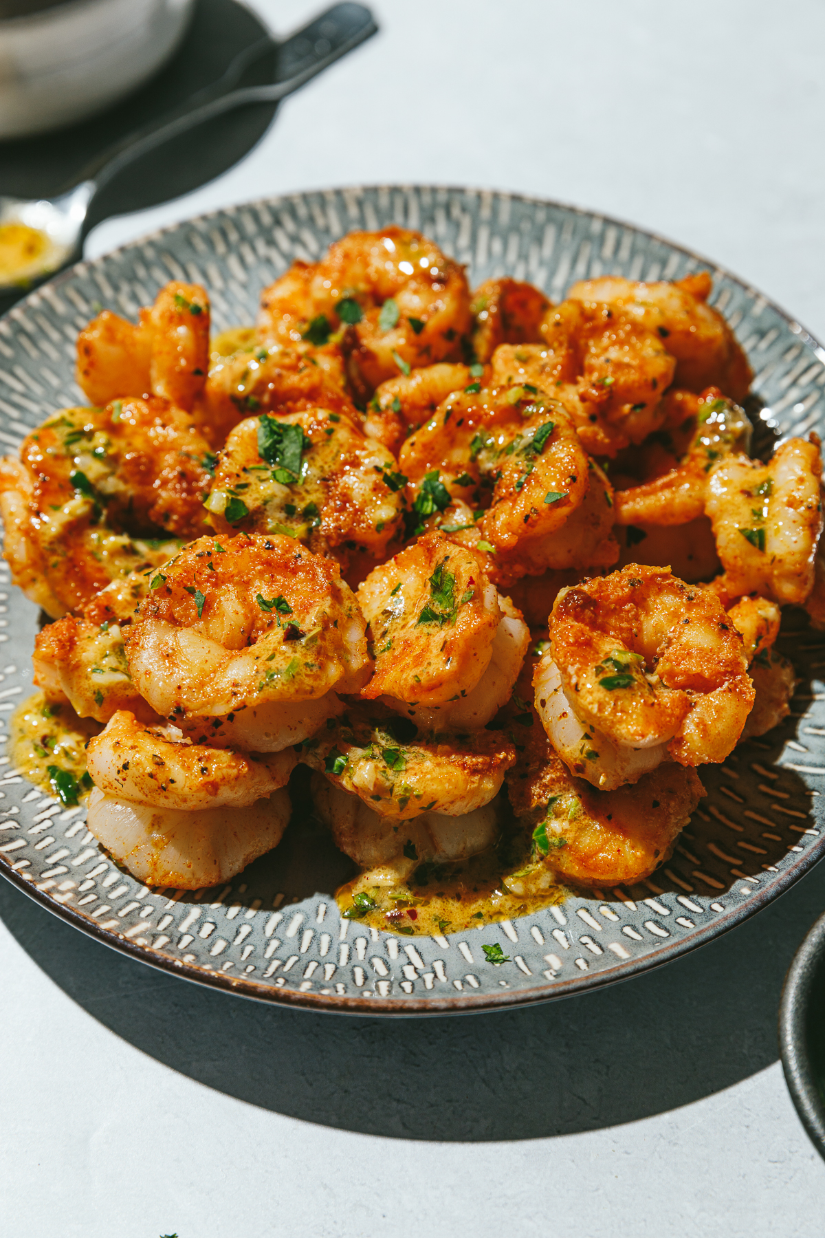 close up cowboy butter shrimp on a plate