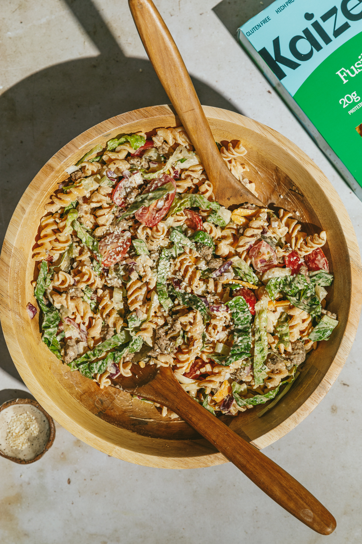 Big Mac pasta salad in a wooden serving bowl.